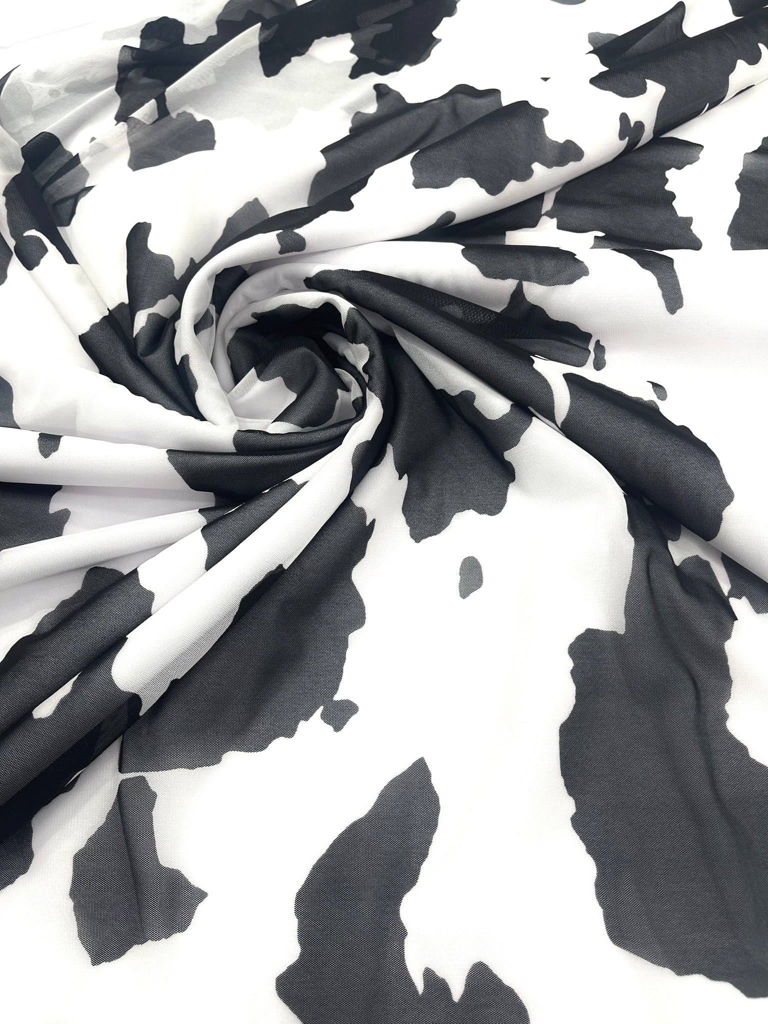 Cow Print 4 Way Stretch Power Mesh Nylon Sheer Fabric | 58 Inches Wide.