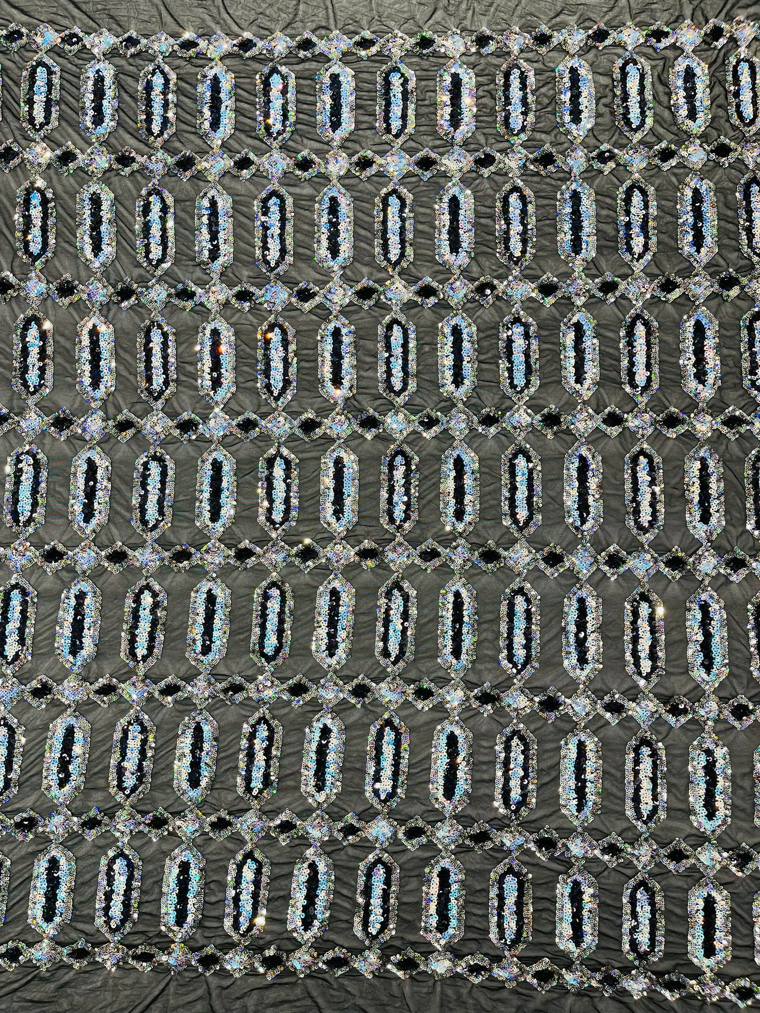 Jewel sequin design on a Cream 4 way stretch mesh fabric.