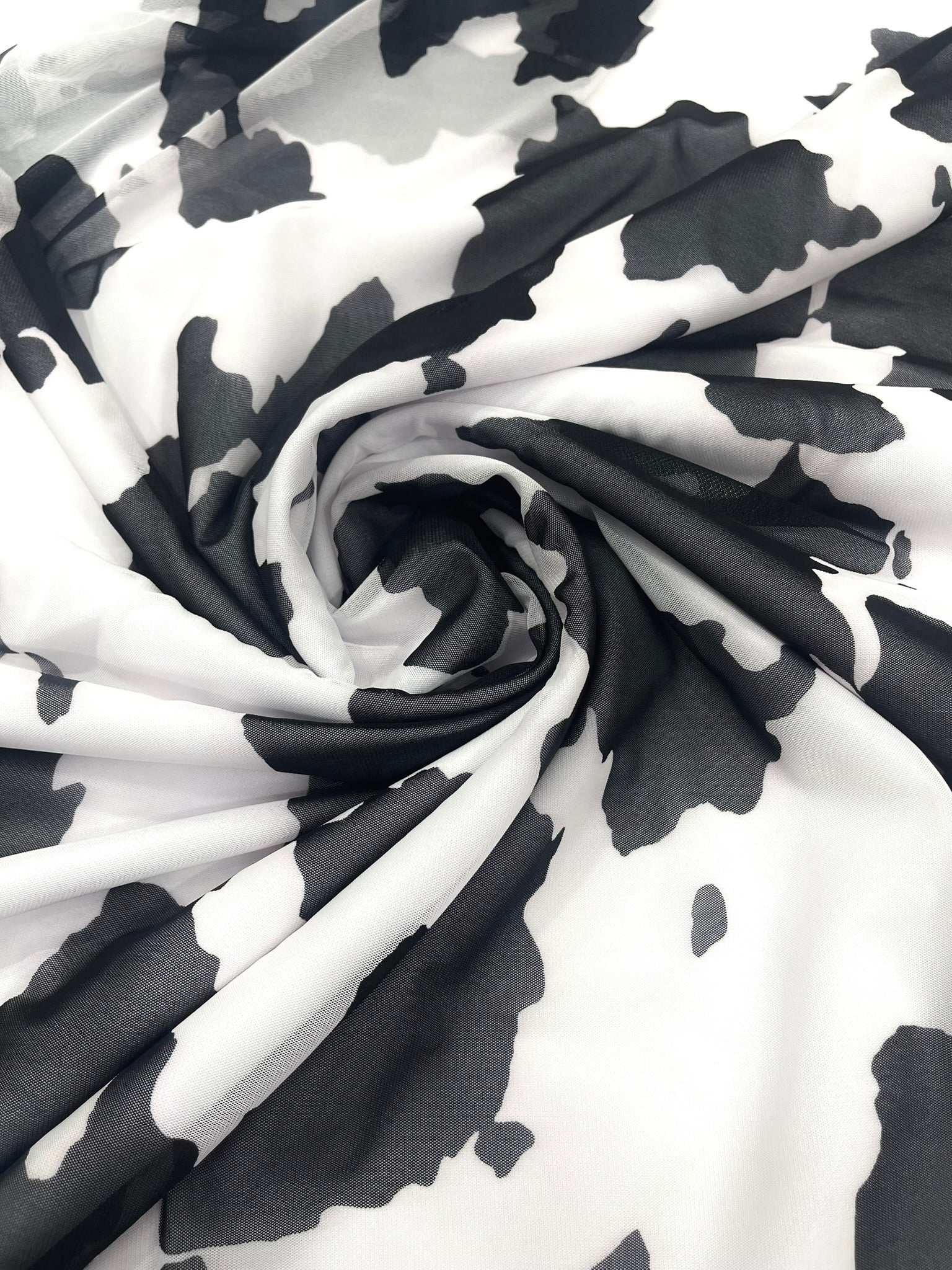 Cow Print 4 Way Stretch Power Mesh Nylon Sheer Fabric | 58 Inches Wide.