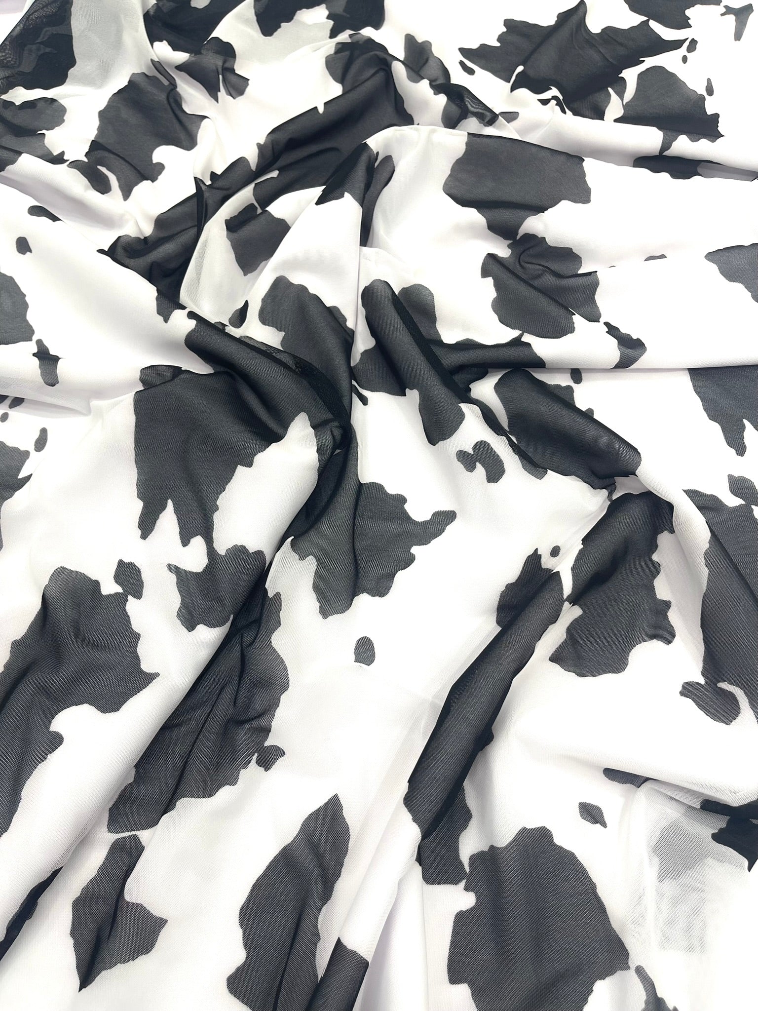 Cow Print 4 Way Stretch Power Mesh Nylon Sheer Fabric | 58 Inches Wide.