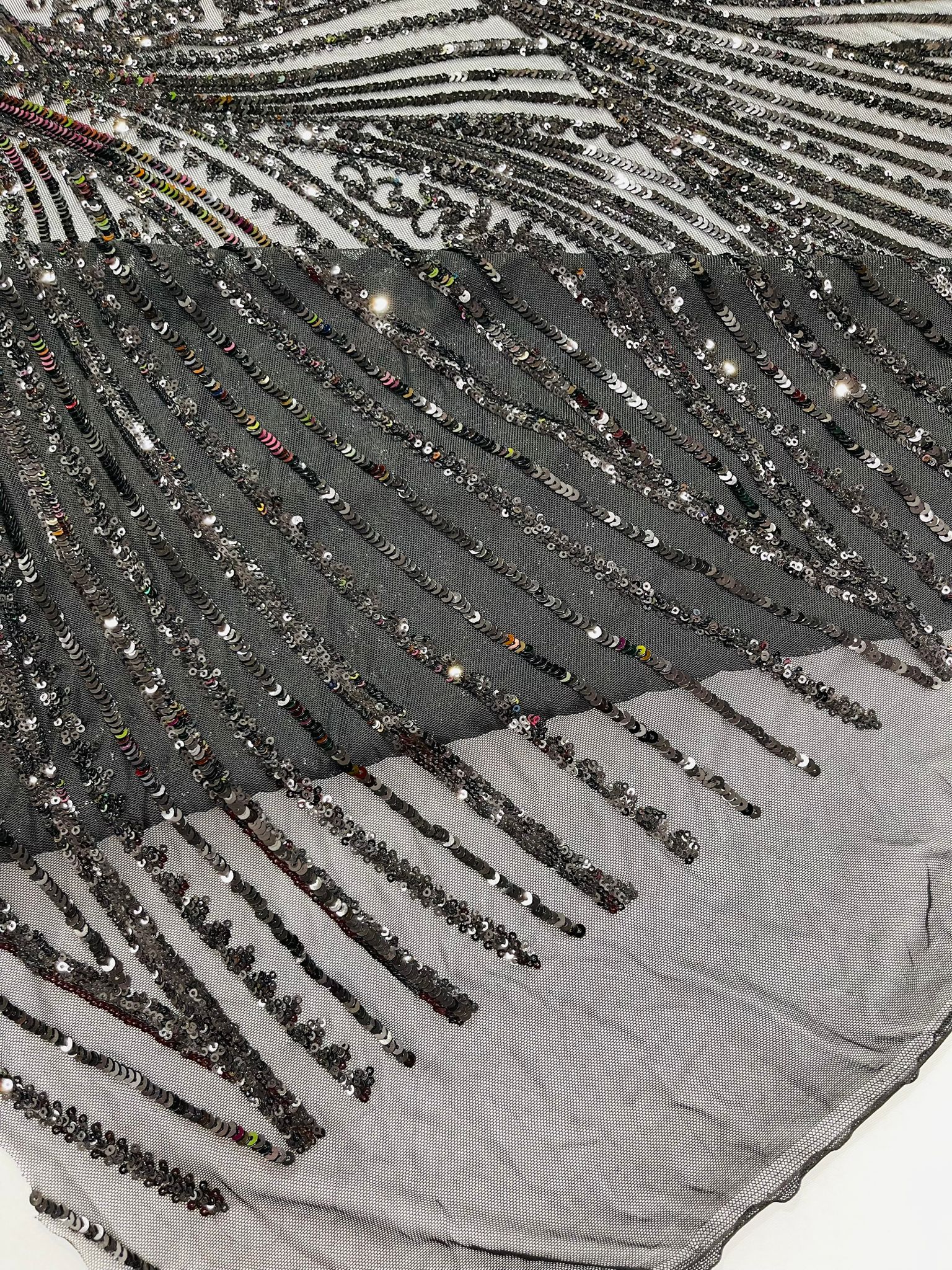 Geometric Feather wing shiny sequin design on a 4 way