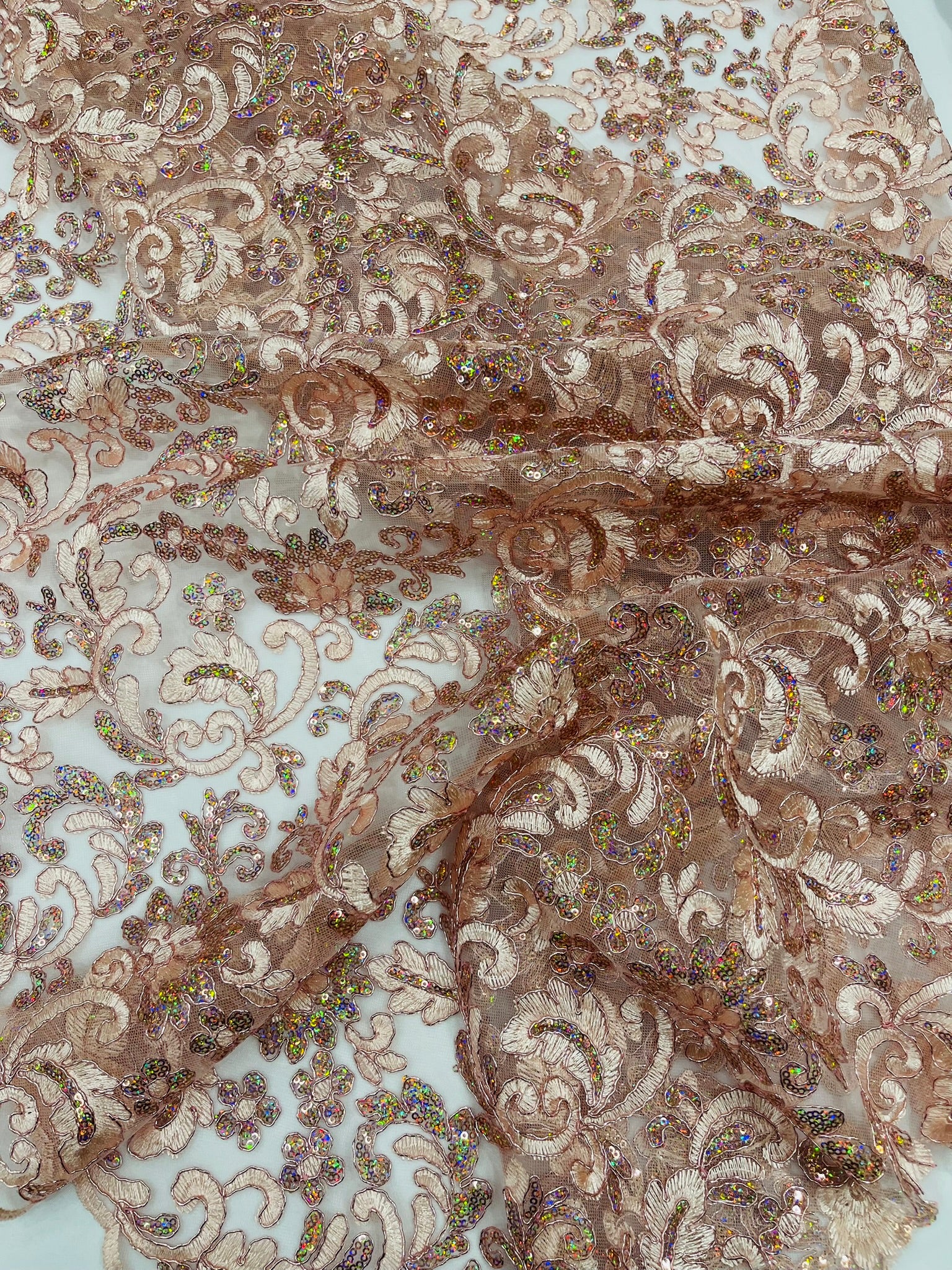 Metallic Corded Lace Design Embroidered With Holographic Sequins on a Mesh 54” Wide.