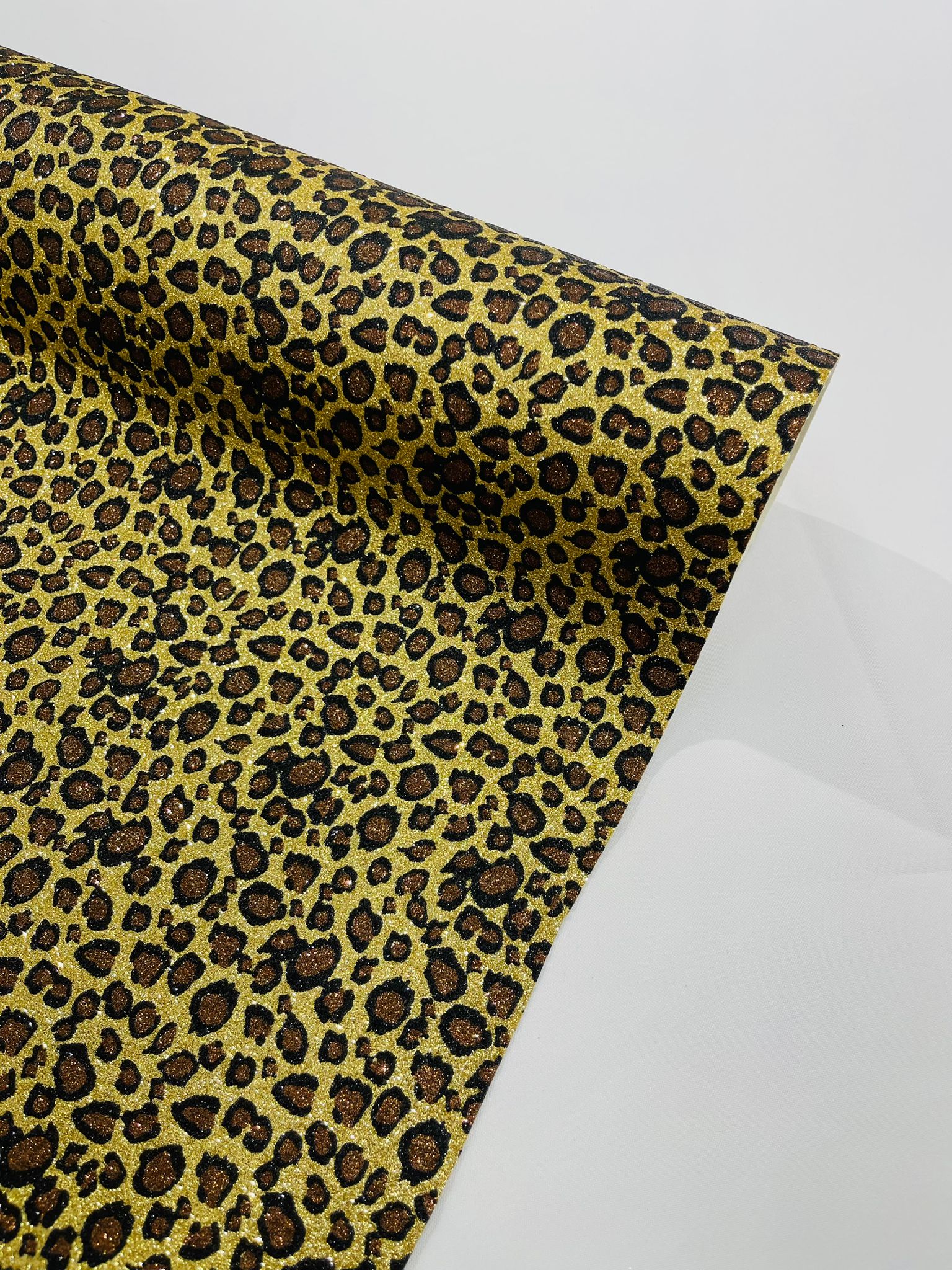 Leopard/ Chita glitter/Sparkle craft Upholstery On A Canvas Backing/Faux vinyl/48” wide.