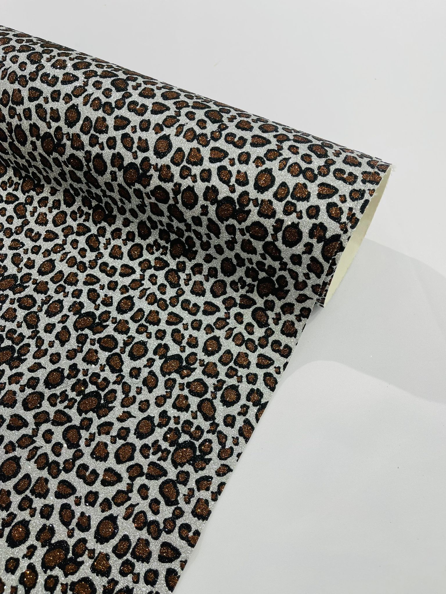 Leopard/ Chita glitter/Sparkle craft Upholstery On A Canvas Backing/Faux vinyl/48” wide.