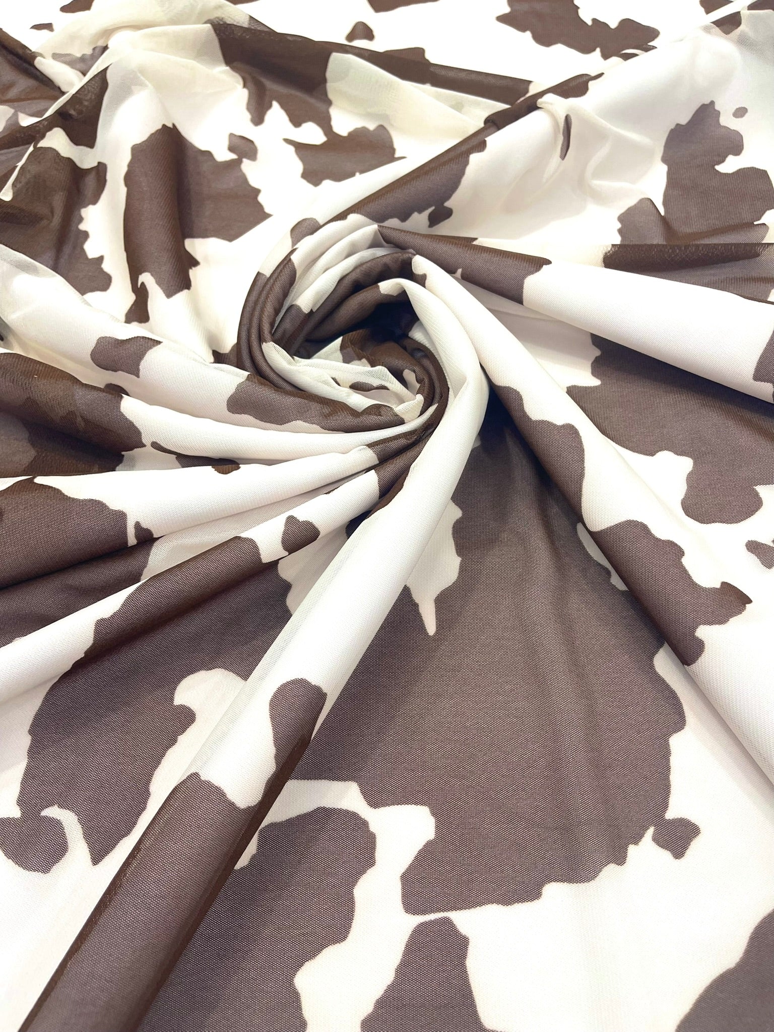 Cow Print 4 Way Stretch Power Mesh Nylon Sheer Fabric | 58 Inches Wide.