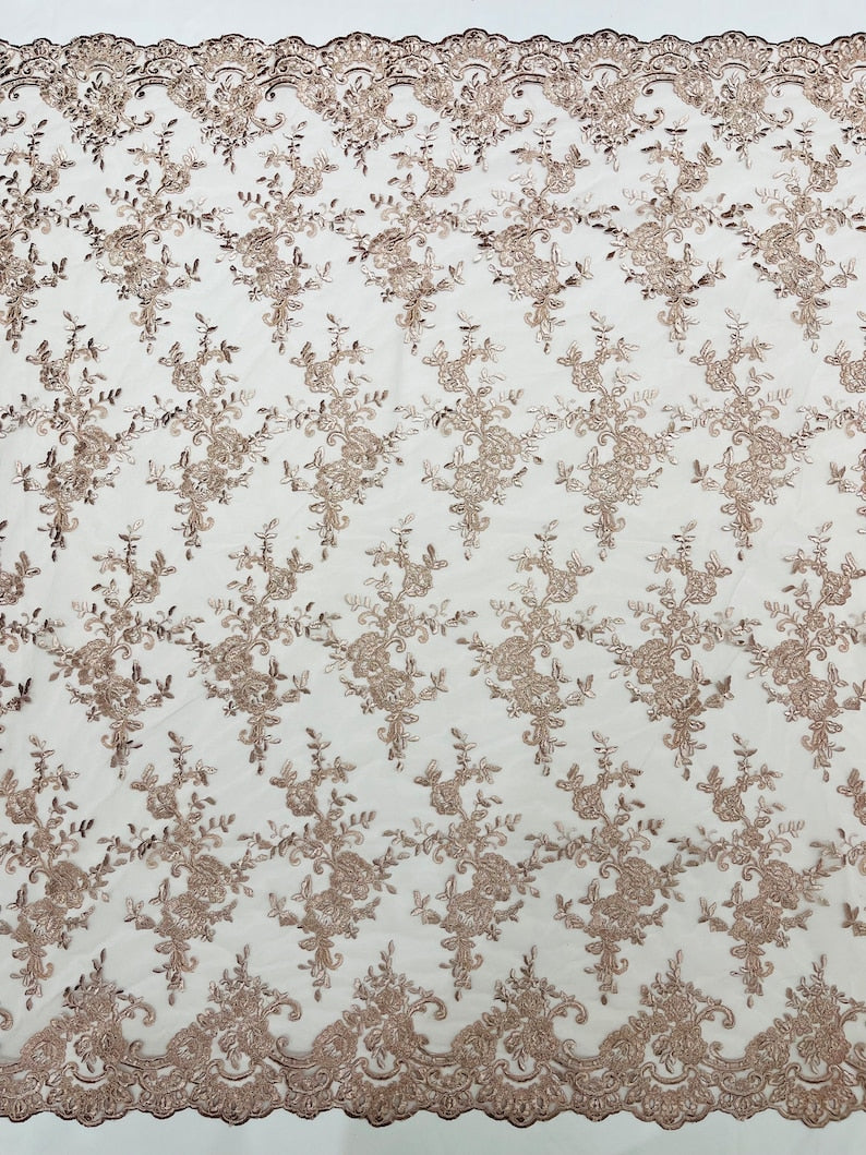 Corded embroider flowers on a mesh lace fabric-prom-sold by the yard.