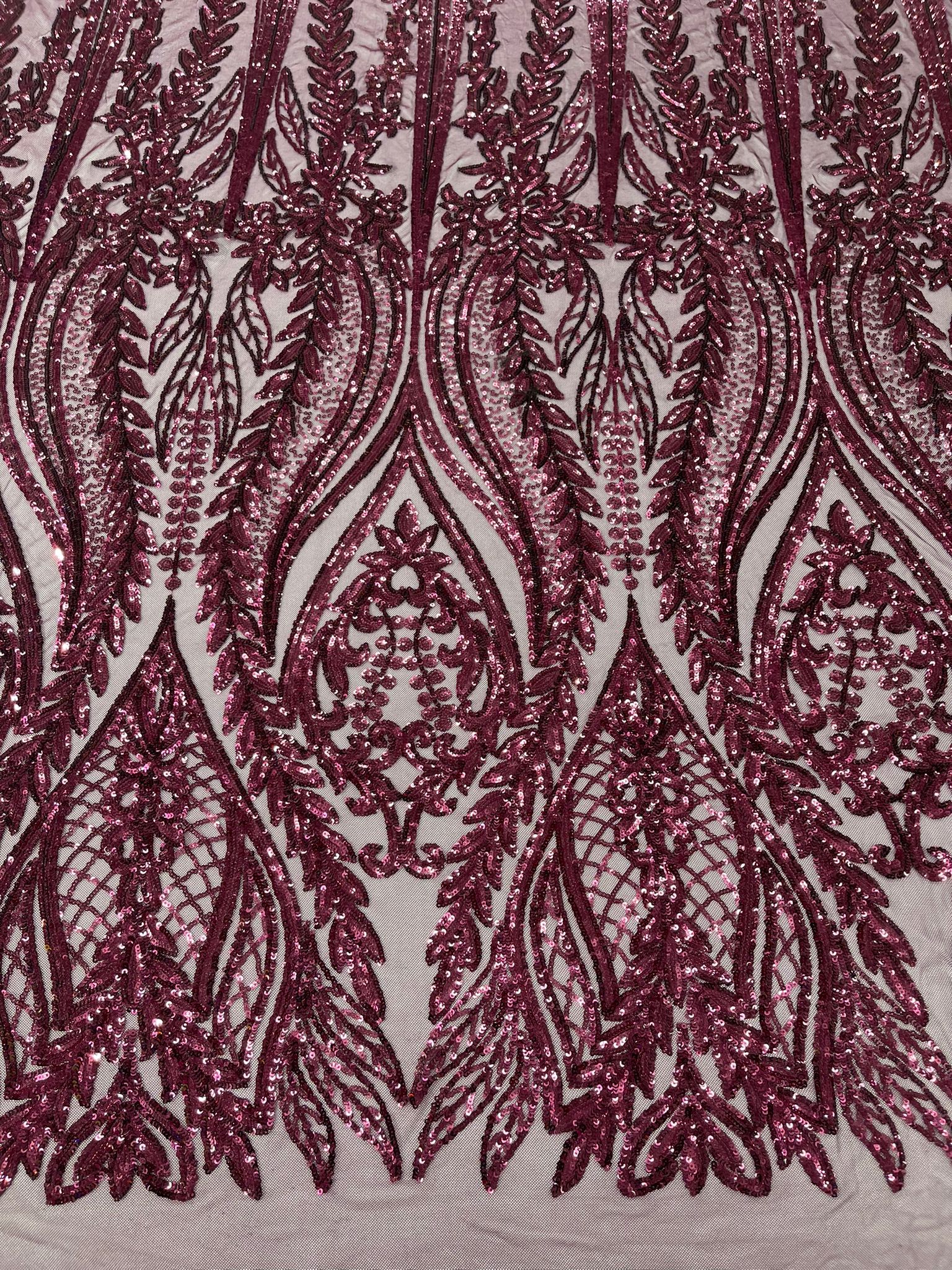 Damask design with sequins embroider on a 4 way stretch mesh fabric.