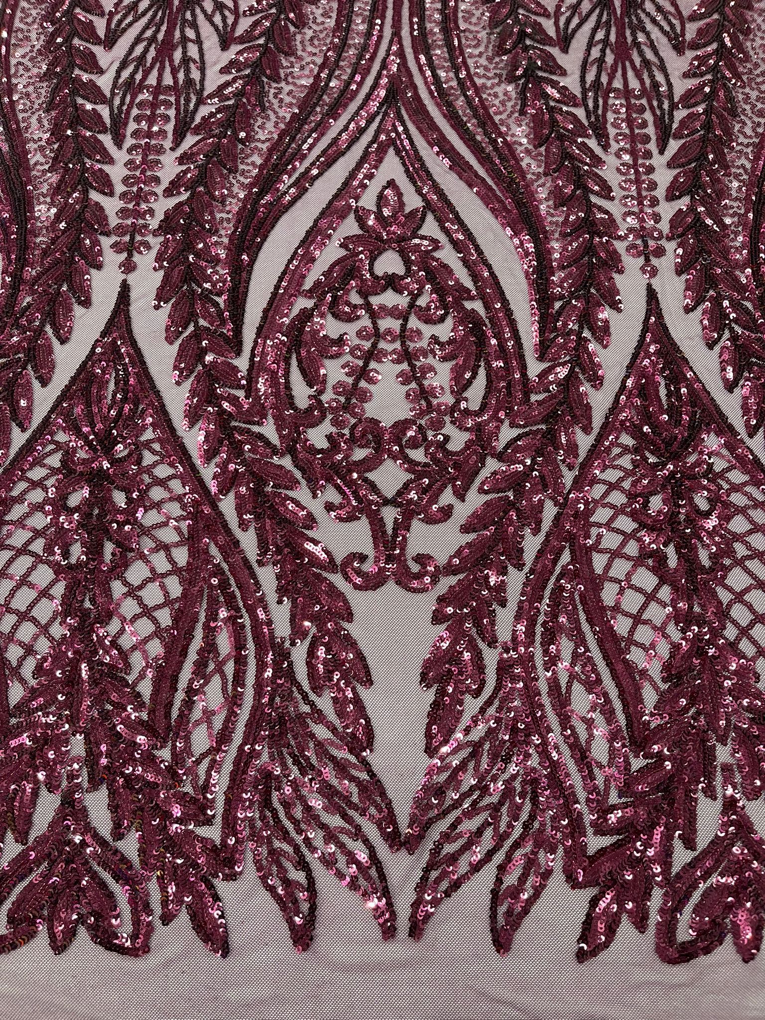 Damask design with sequins embroider on a 4 way stretch mesh fabric.