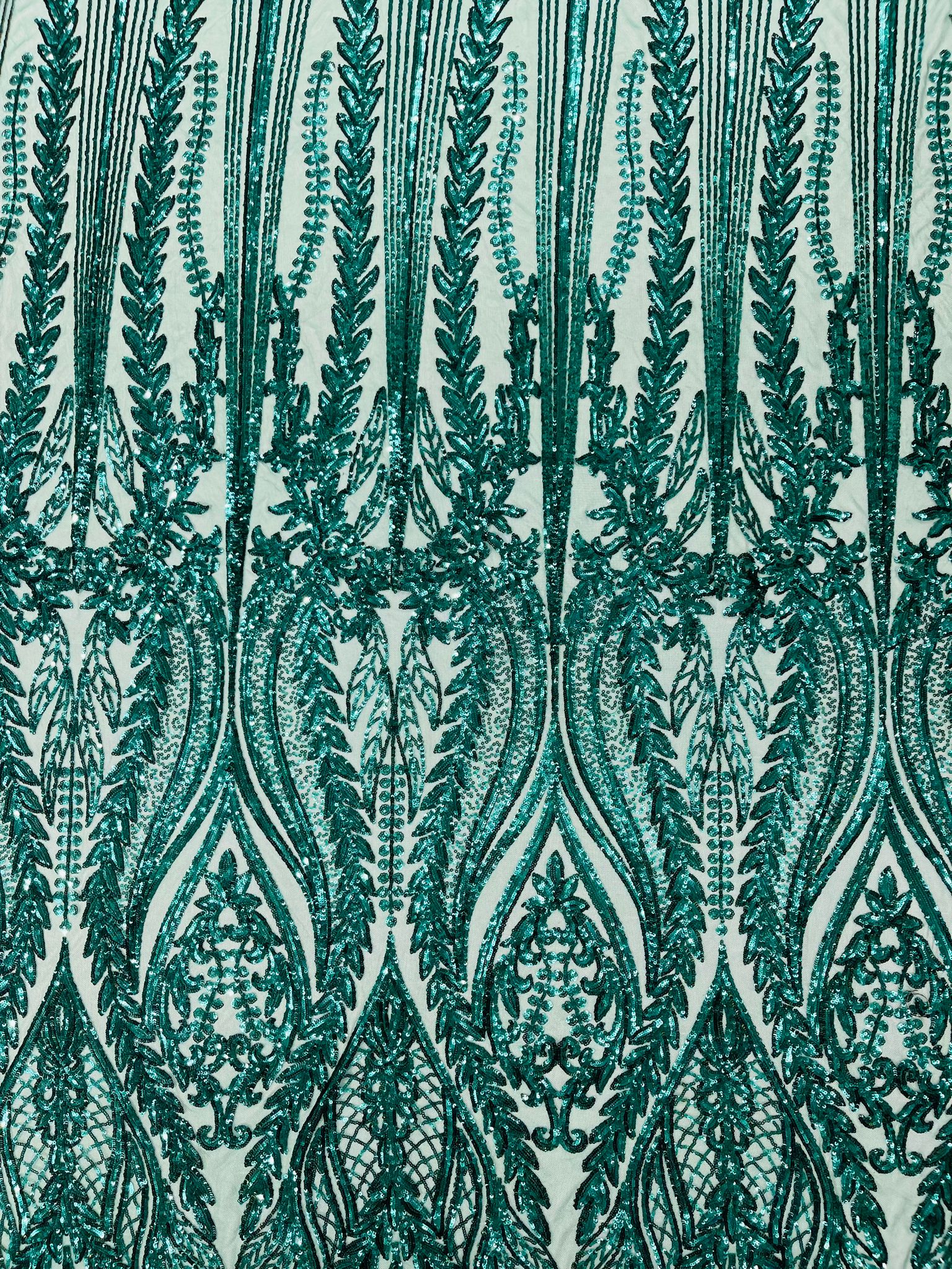 Damask design with sequins embroider on a 4 way stretch mesh fabric.