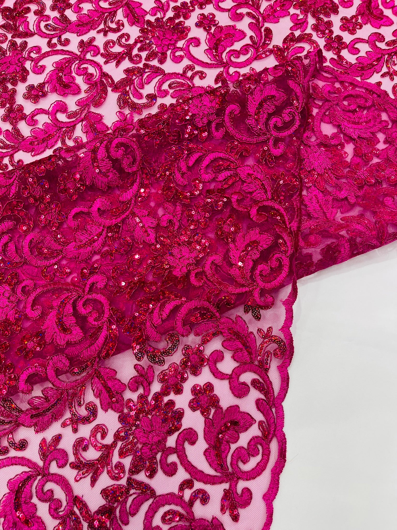 Metallic Corded Lace Design Embroidered With Holographic Sequins on a Mesh 54” Wide.