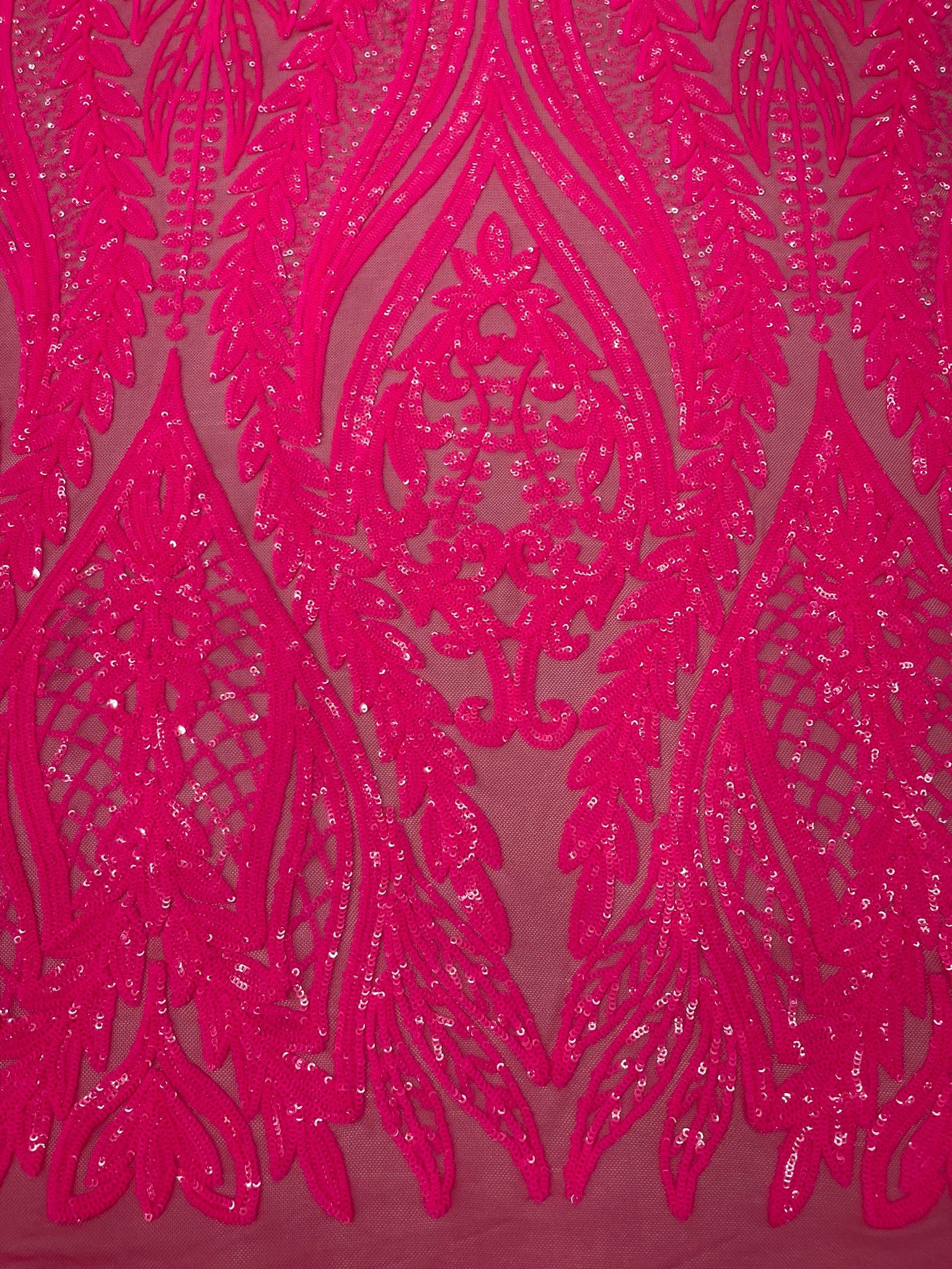 Damask design with sequins embroider on a 4 way stretch mesh fabric.