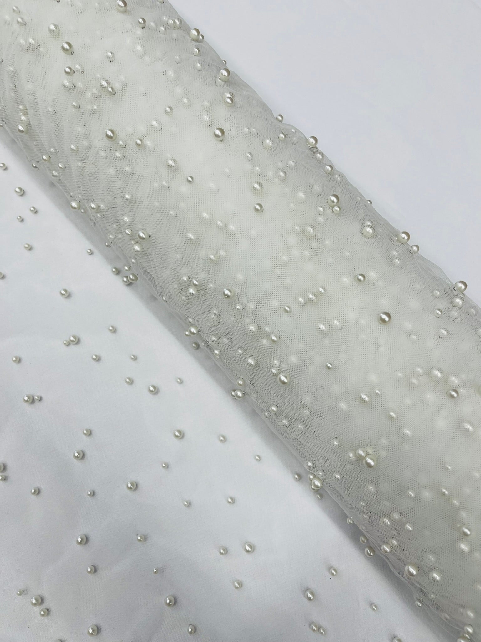 Scattered Pearls Studded Mesh, 2-Way Stretch, Sold by the yard.