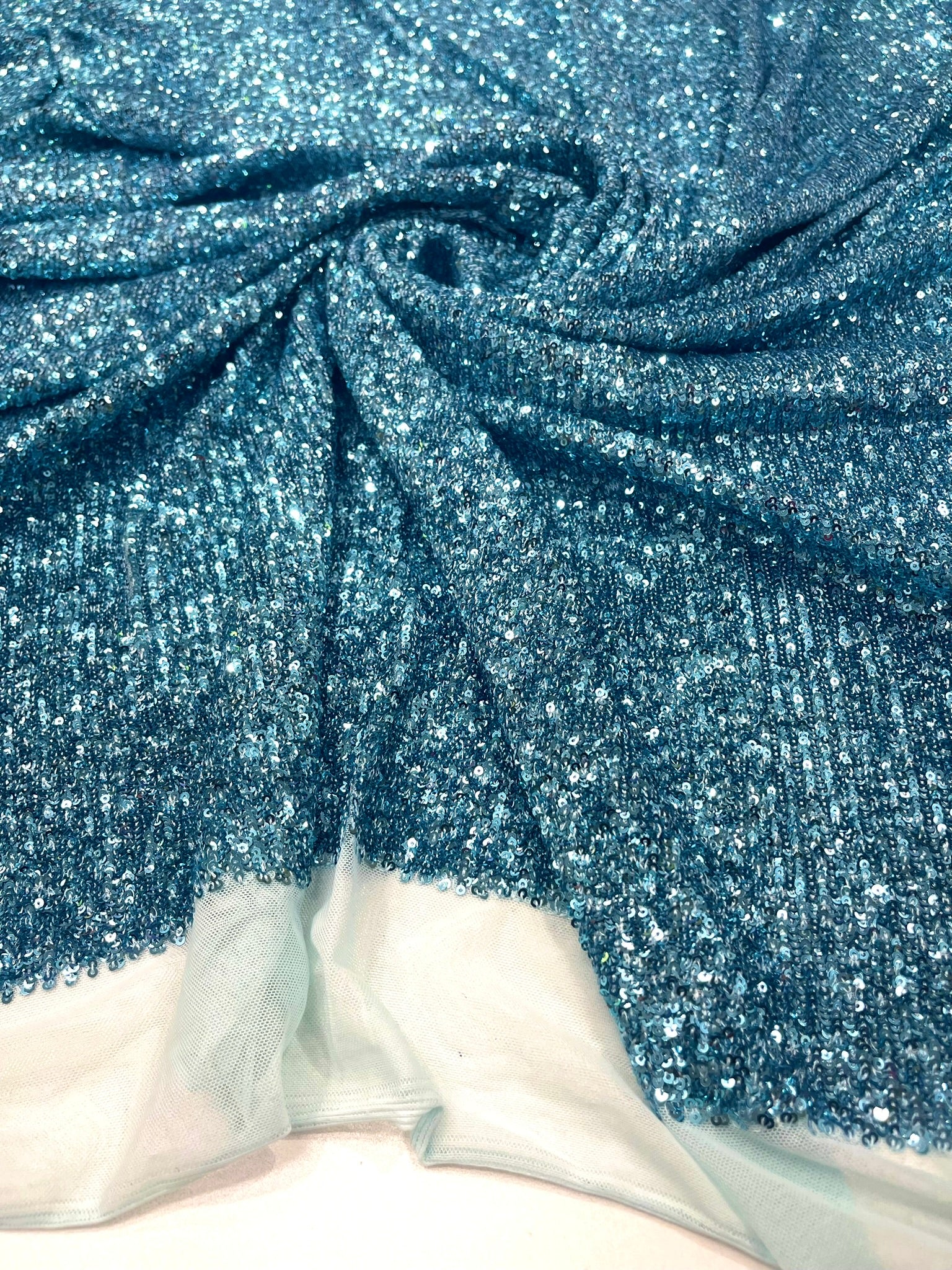 Chain shiny clear sequins design on a 4 way stretch mesh fabric -Sold by the yard.