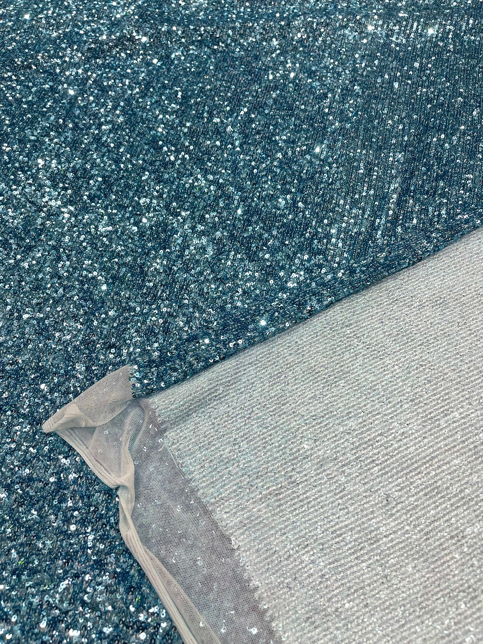 Chain shiny clear sequins design on a 4 way stretch mesh fabric -Sold by the yard.