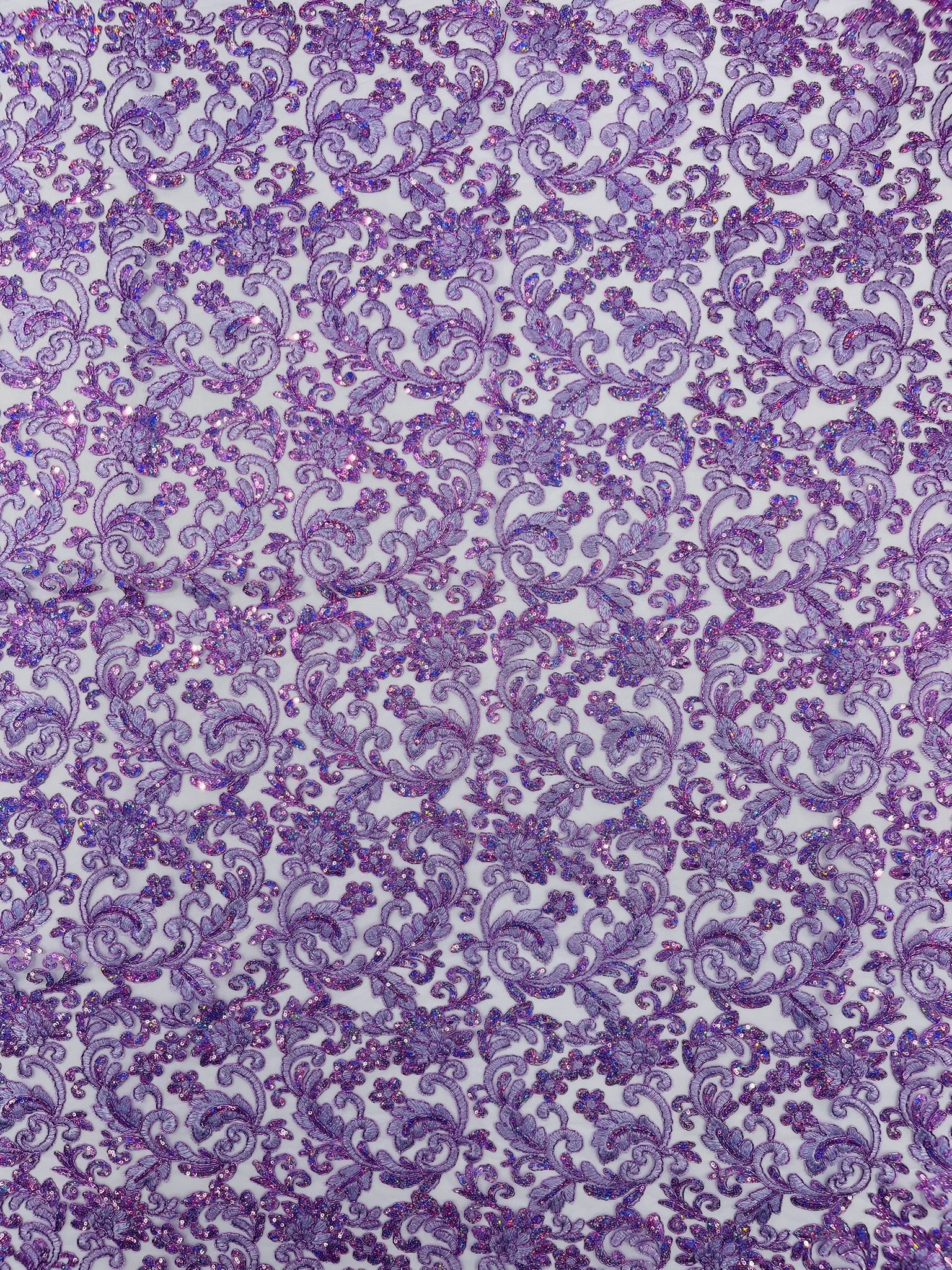 Metallic Corded Lace Design Embroidered With Holographic Sequins on a Mesh 54” Wide.