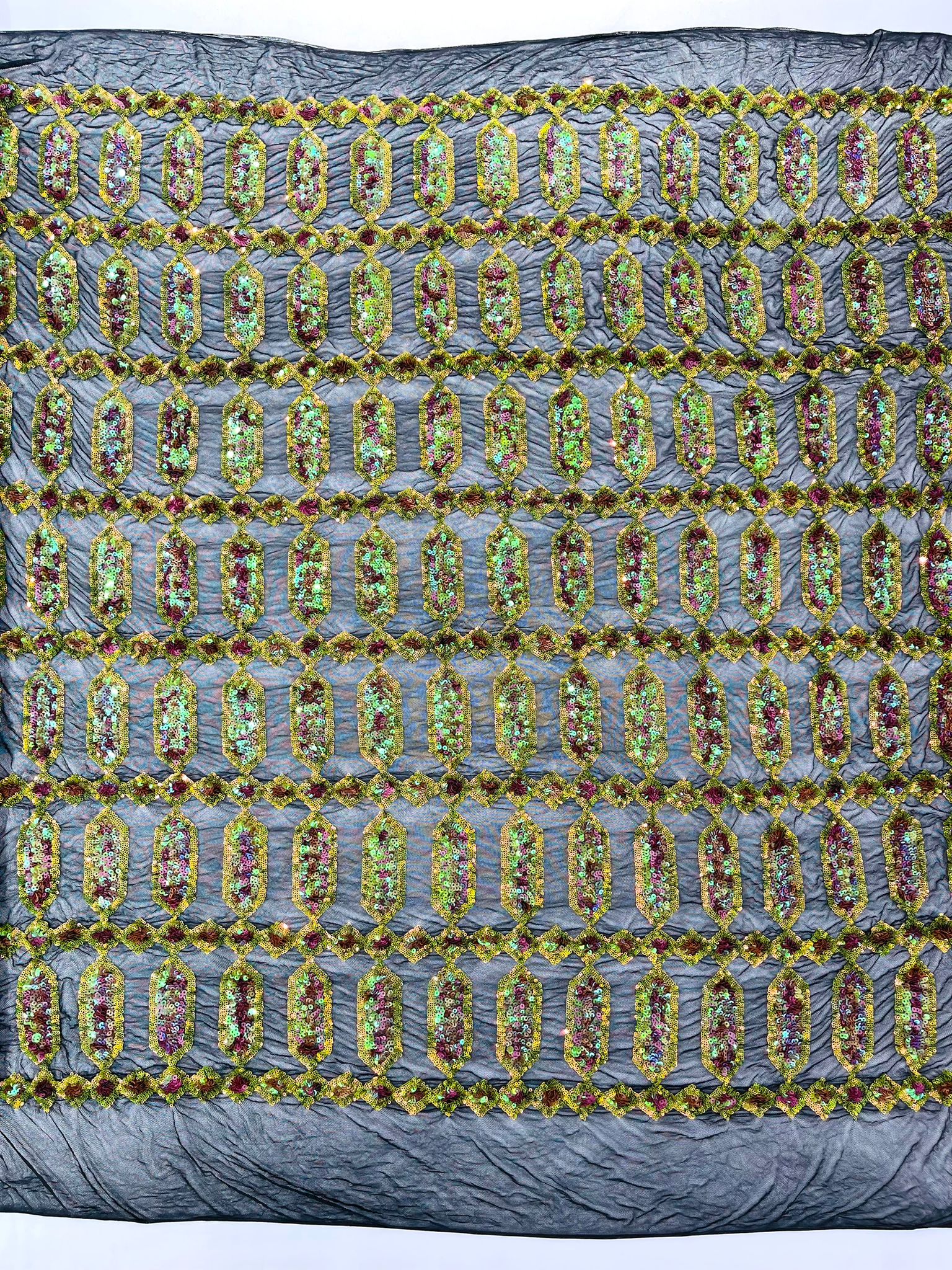 Moss Green/pink coral multi color iridescent Jewel sequin design on a black 4 way stretch mesh fabric.