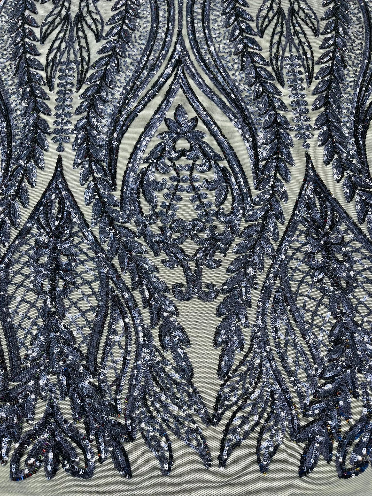 Damask design with sequins embroider on a 4 way stretch mesh fabric.