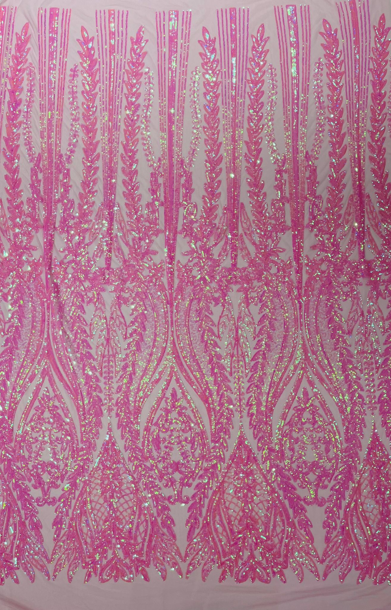 Damask design with sequins embroider on a 4 way stretch mesh fabric.