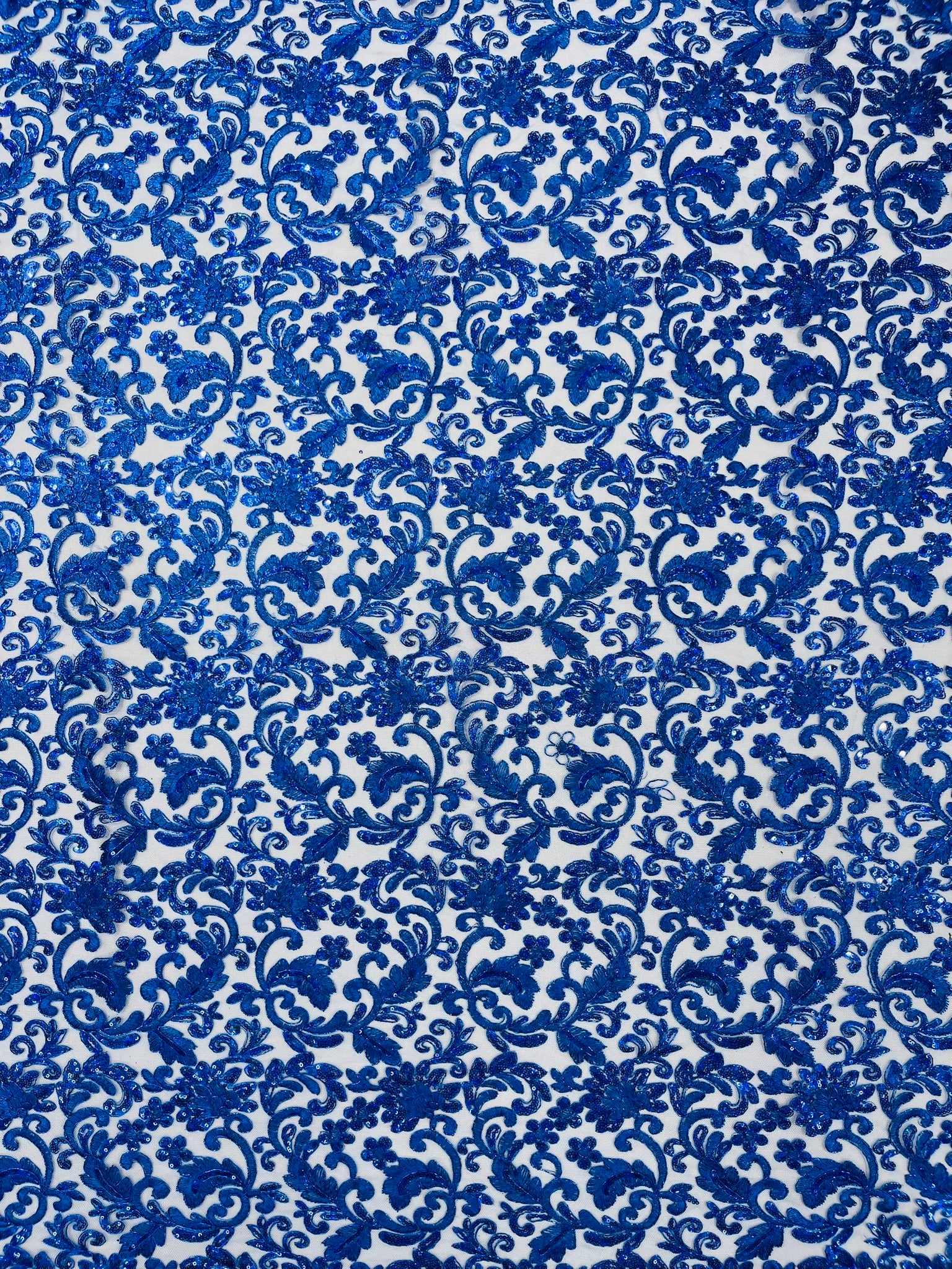 Metallic Corded Lace Design Embroidered With Holographic Sequins on a Mesh 54” Wide.