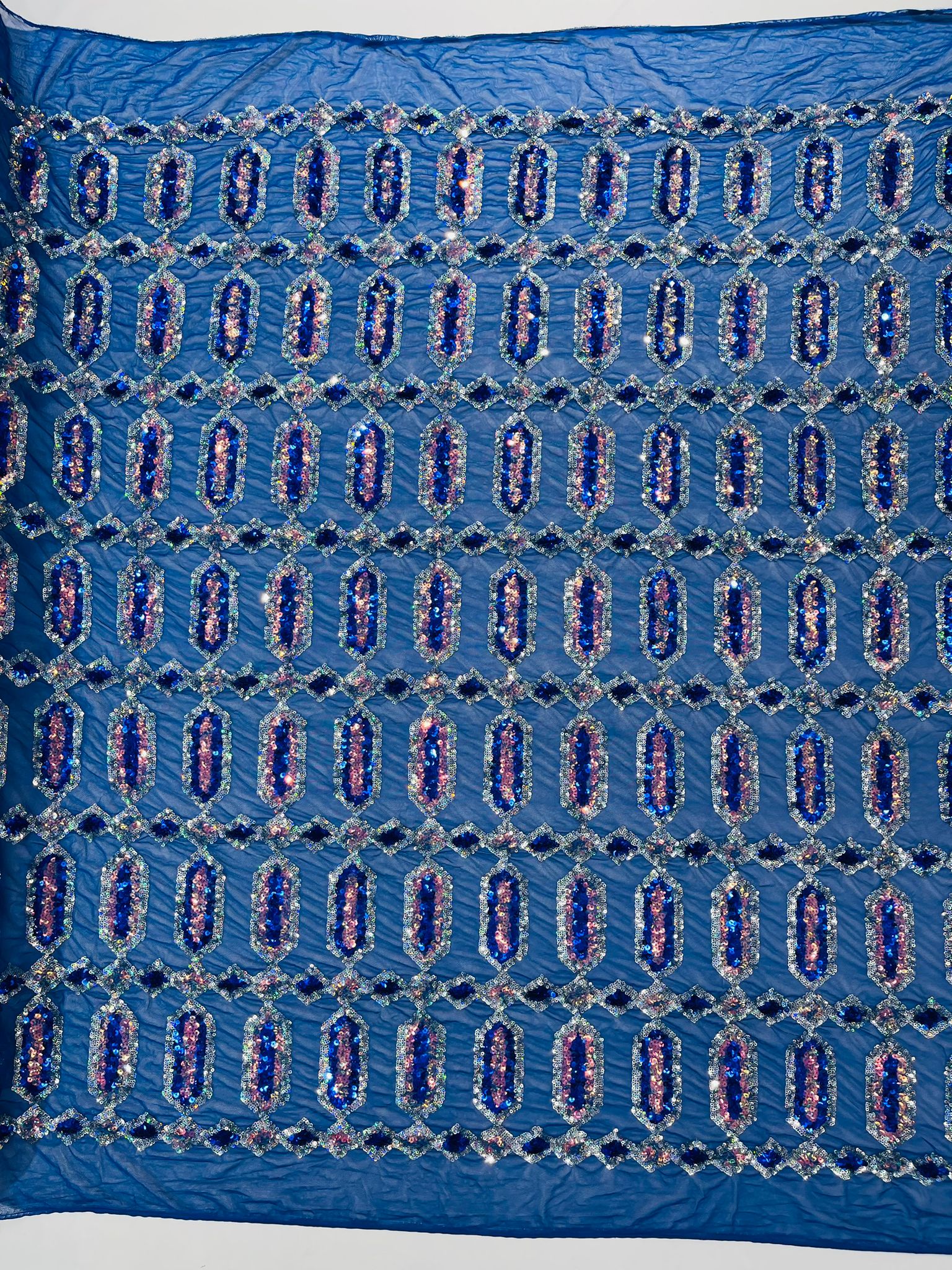 Royal Blue/Silver multi color iridescent Jewel sequin design on a Royal Blue 4 way stretch mesh fabric.