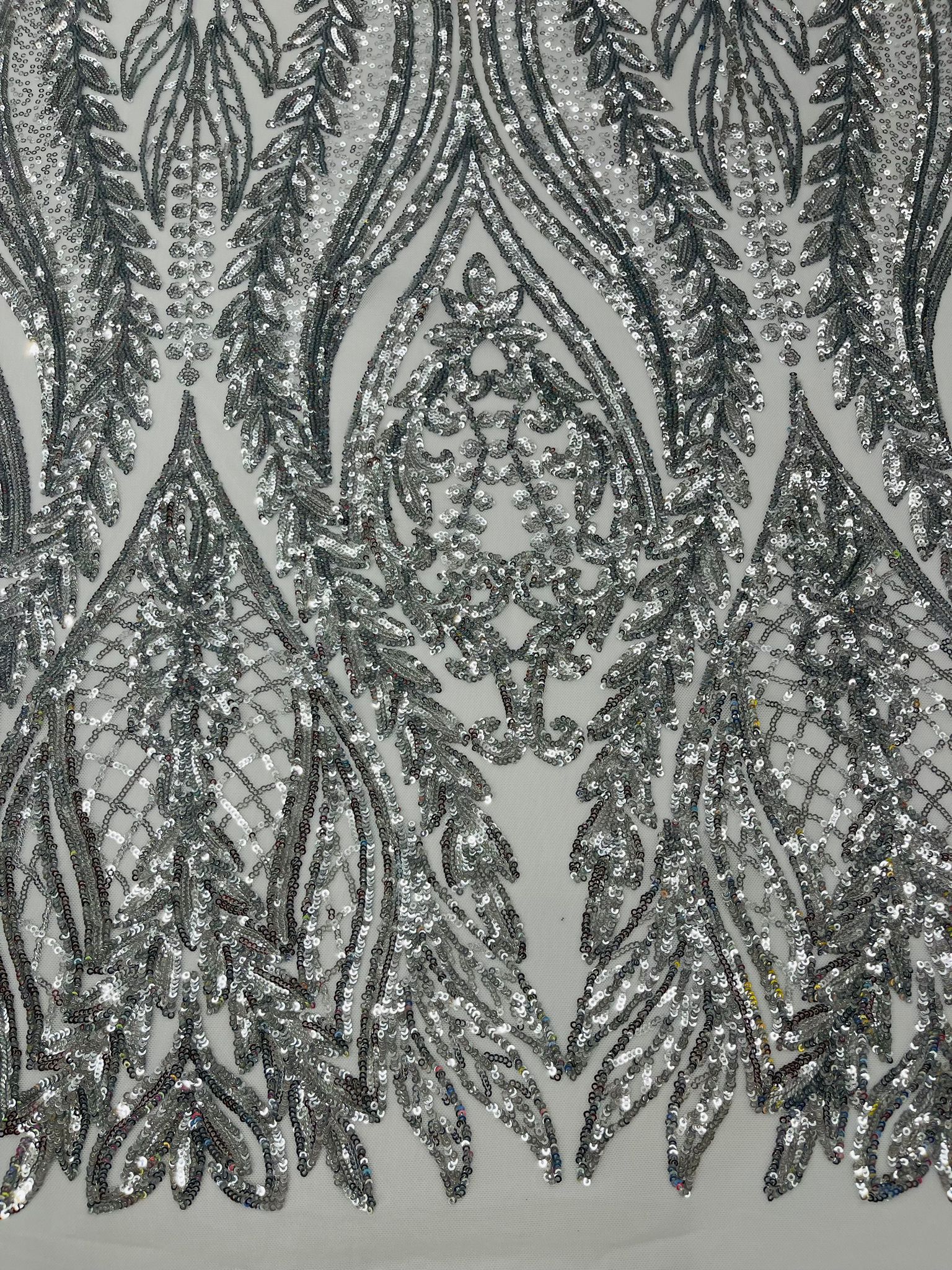 Damask design with sequins embroider on a 4 way stretch mesh fabric.