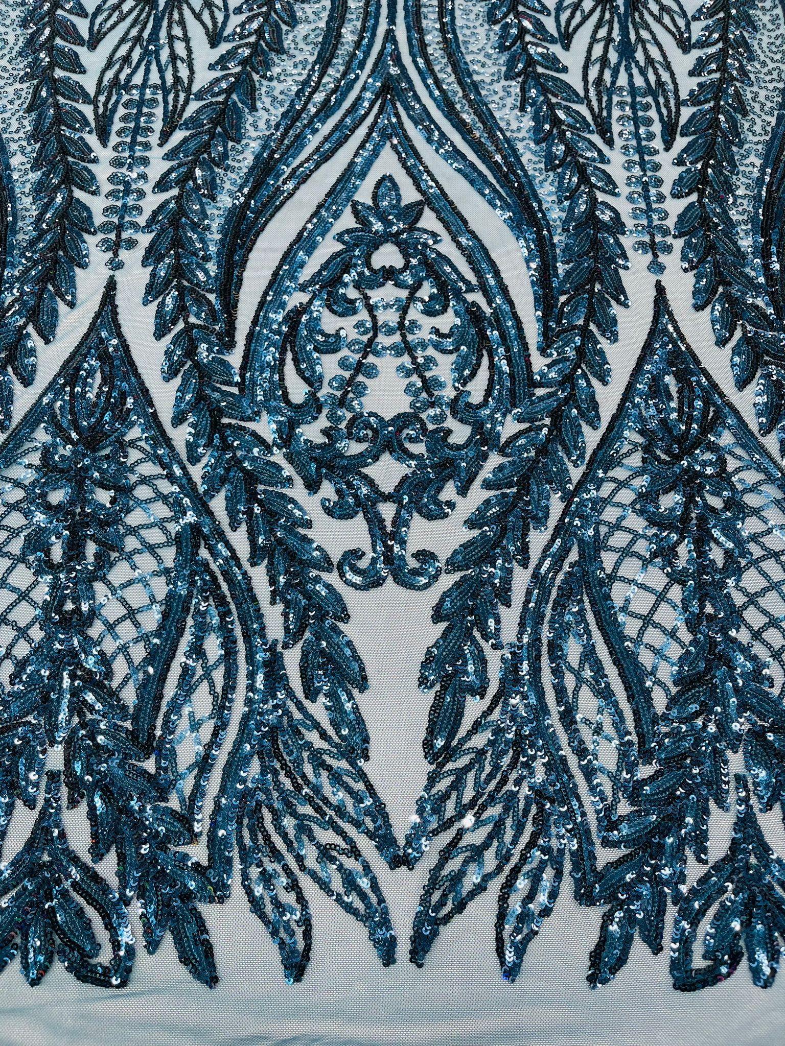 Damask design with sequins embroider on a 4 way stretch mesh fabric.