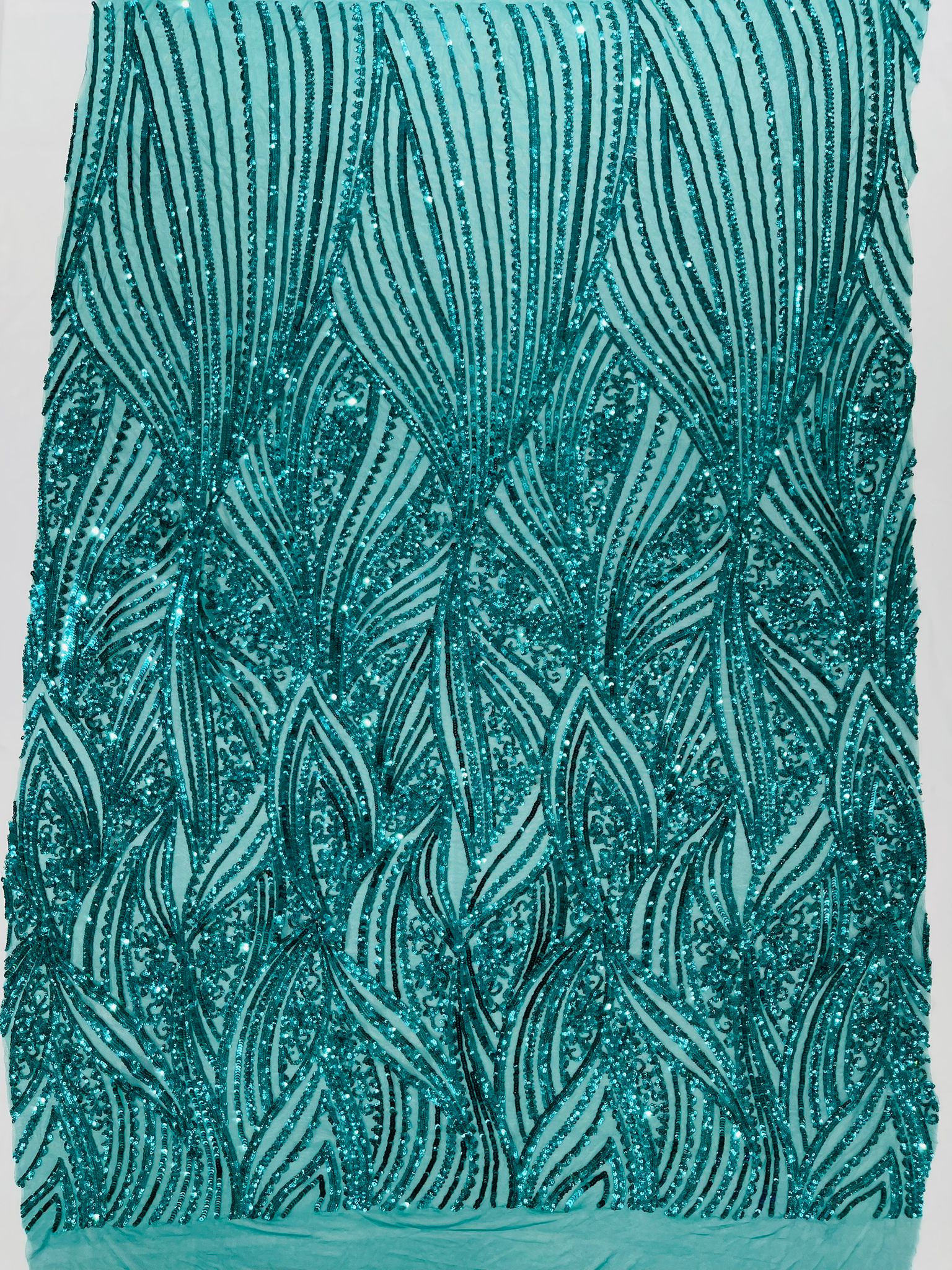 Geometric Feather wing shiny sequin design on a 4 way stretch mesh Fabric-prom-sold by the yard.