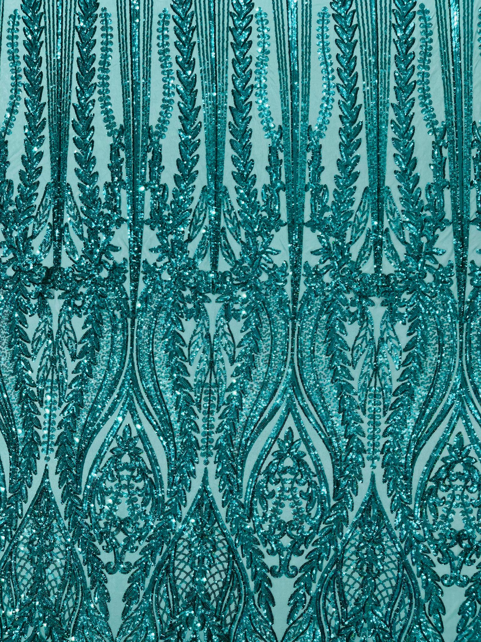 Damask design with sequins embroider on a 4 way stretch mesh fabric.