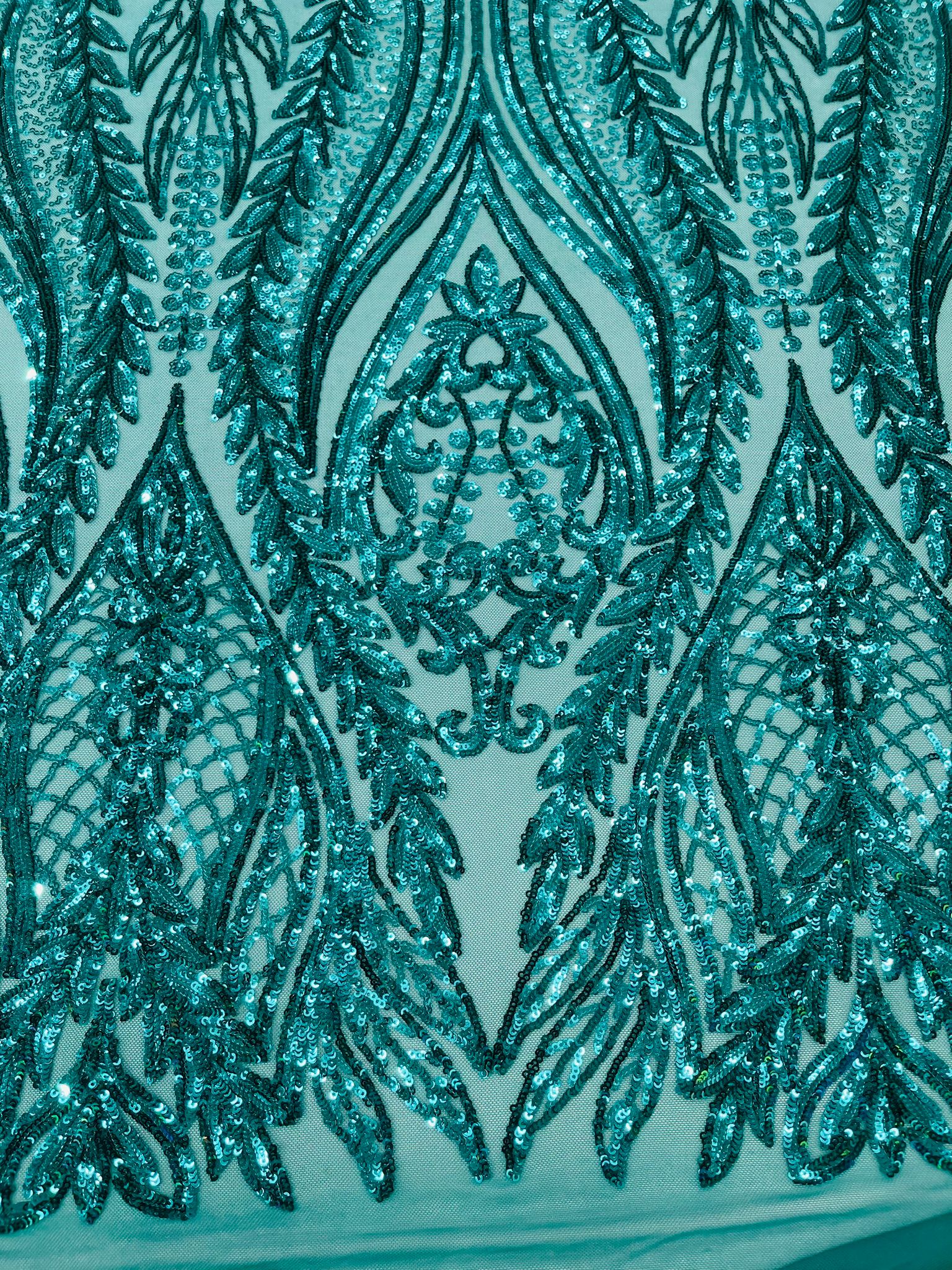 Damask design with sequins embroider on a 4 way stretch mesh fabric.