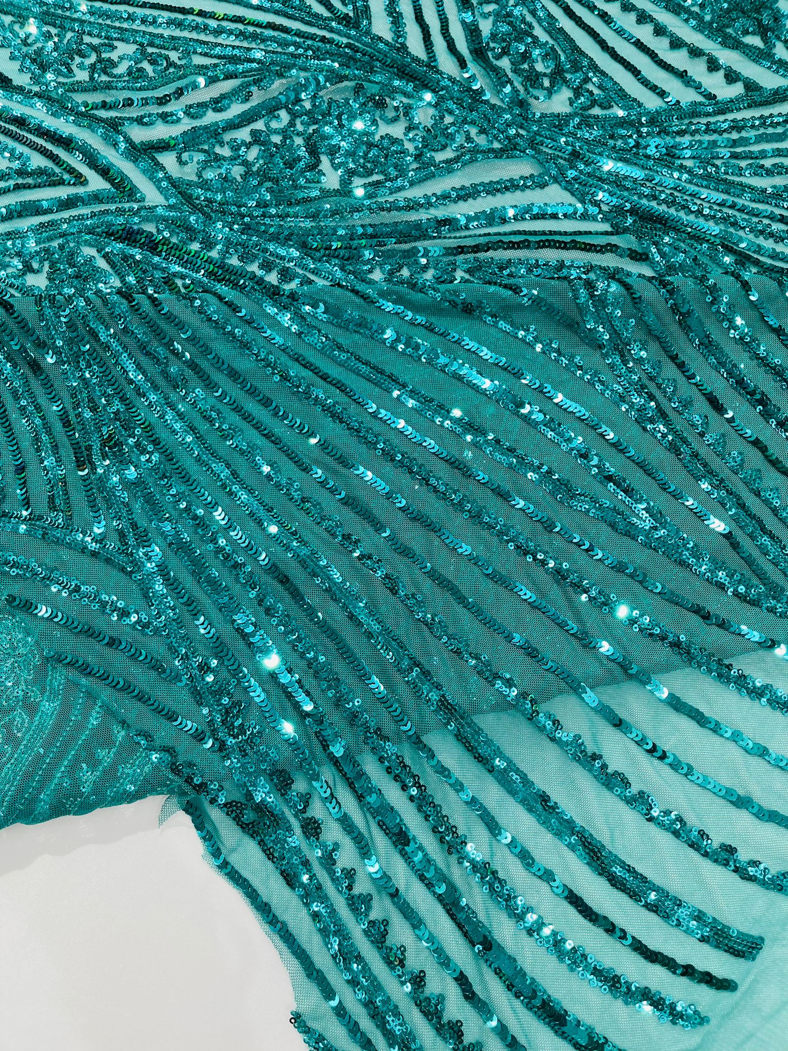 Geometric Feather wing shiny sequin design on a 4 way stretch mesh Fabric-prom-sold by the yard.