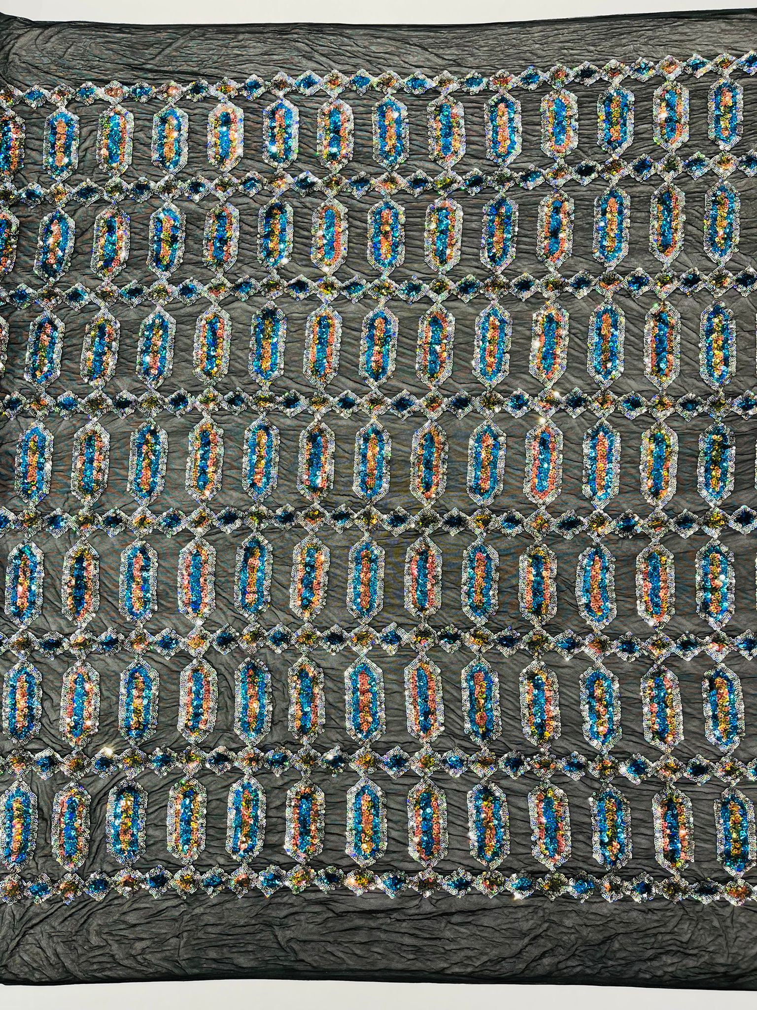 Jewel sequin design on a Cream 4 way stretch mesh fabric.