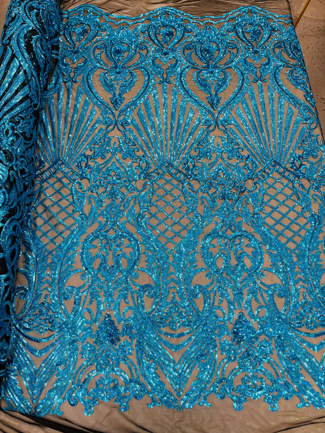 Seashell Geometric Sequins - Turquoise on Black - Embroidered Sequins on 4 Way Stretch Lace Mesh Sold By Yard