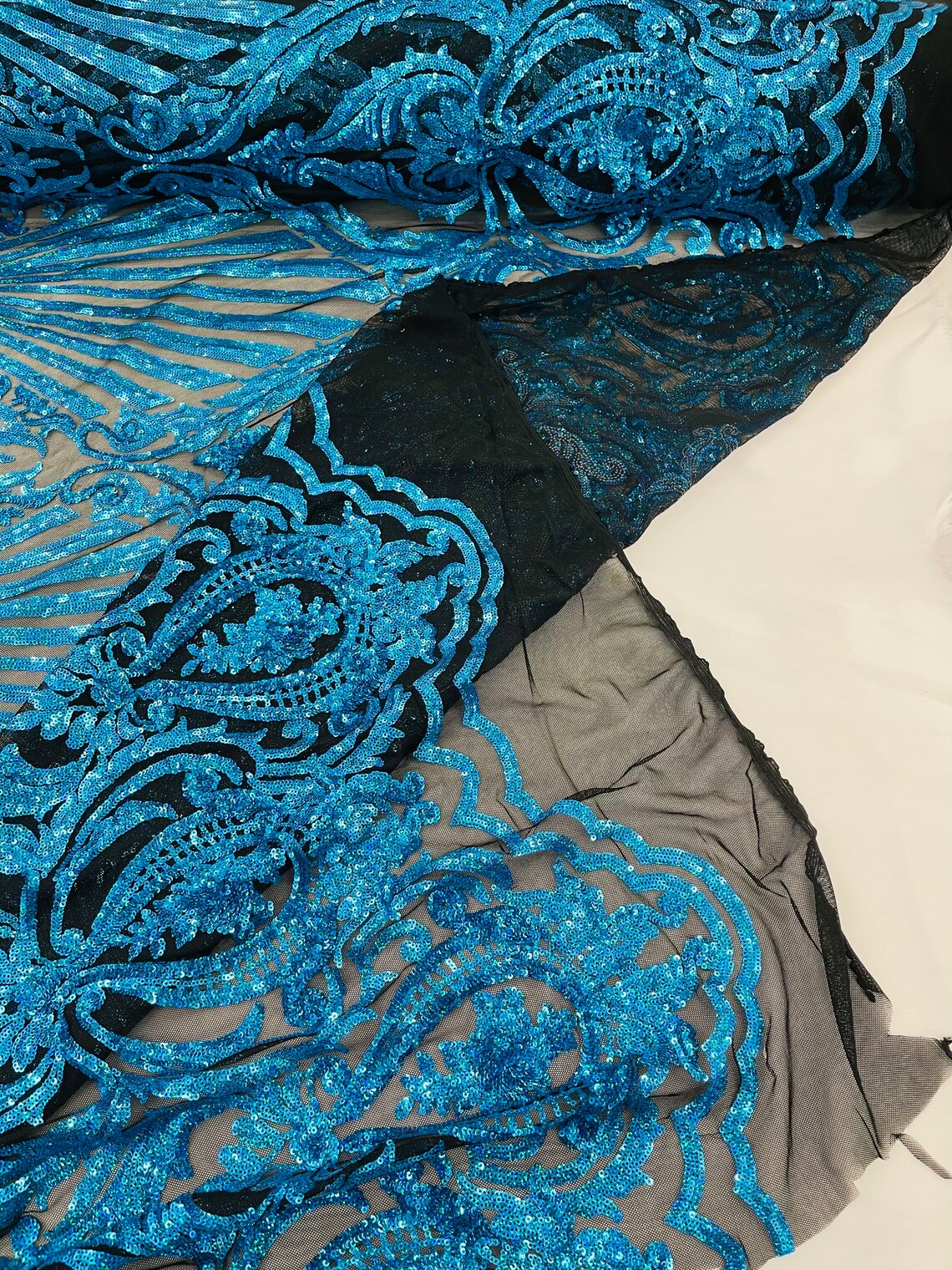 Seashell Geometric Sequins - Turquoise on Black - Embroidered Sequins on 4 Way Stretch Lace Mesh Sold By Yard