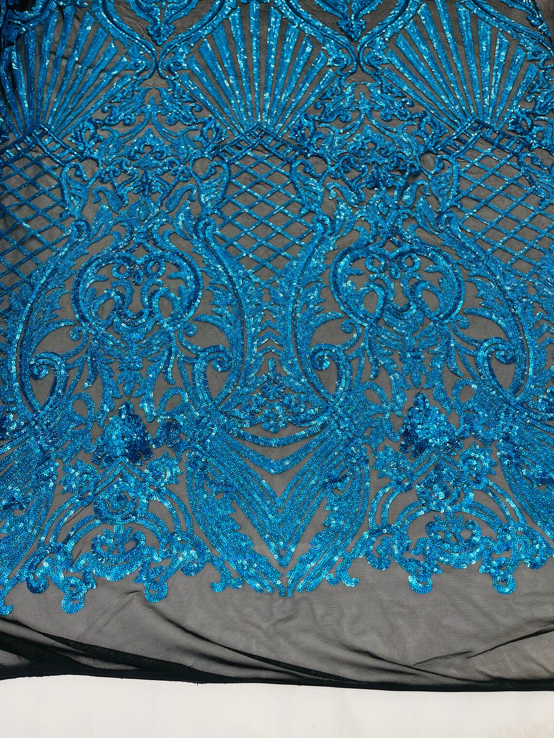 Seashell Geometric Sequins - Turquoise on Black - Embroidered Sequins on 4 Way Stretch Lace Mesh Sold By Yard