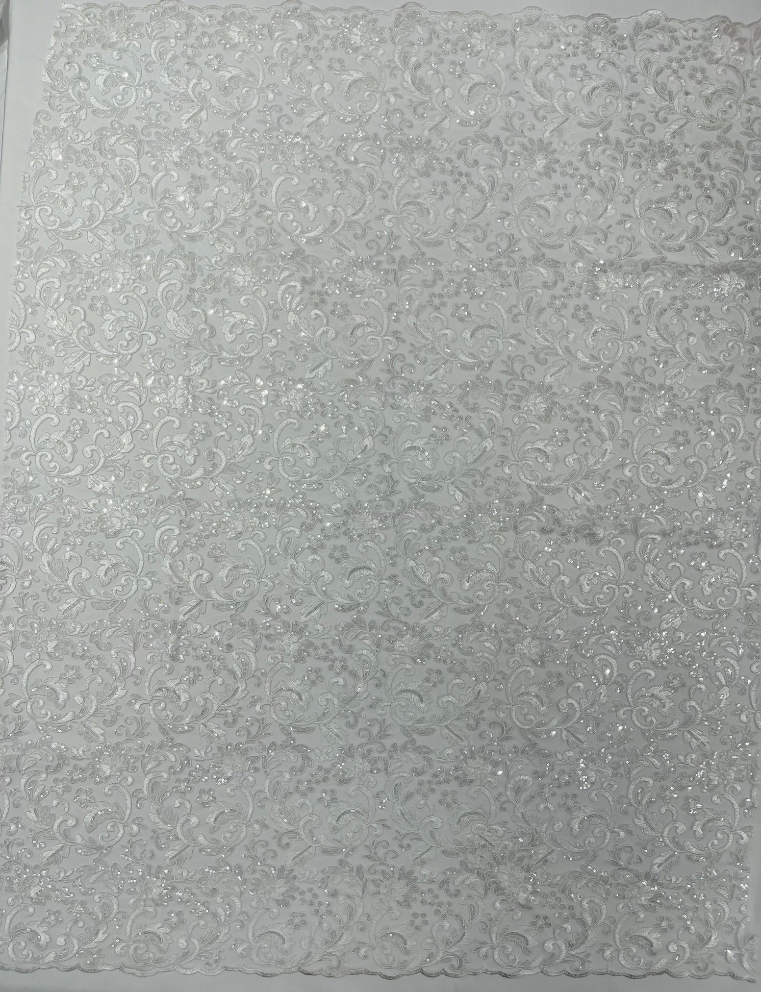 Metallic Corded Lace Design Embroidered With Holographic Sequins on a Mesh 54” Wide.