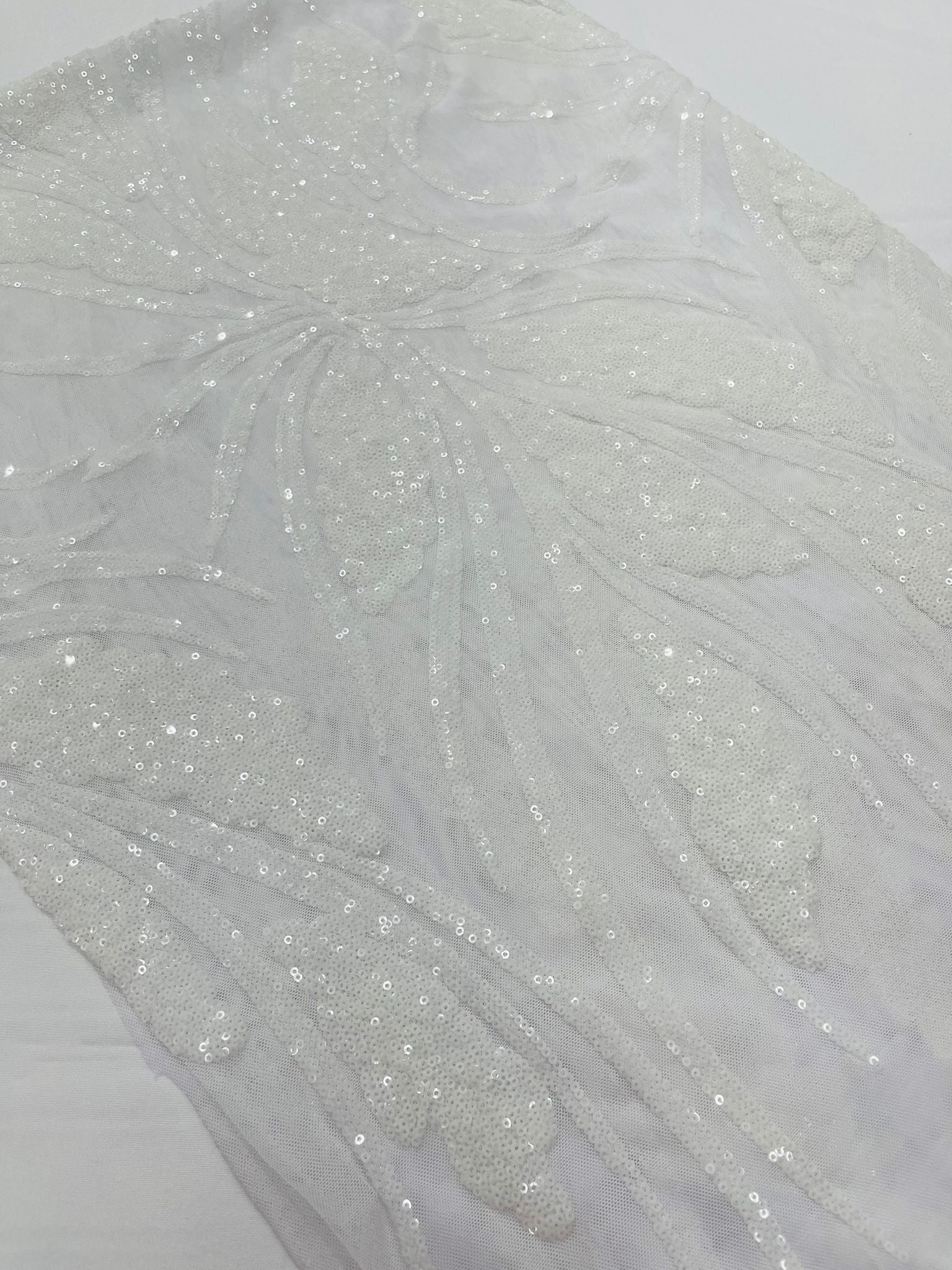 Feather damask shiny sequin design on a 4 way stretch White mesh Fabri Feather damask shiny sequin design on a 4 way stretch White mesh Fabri