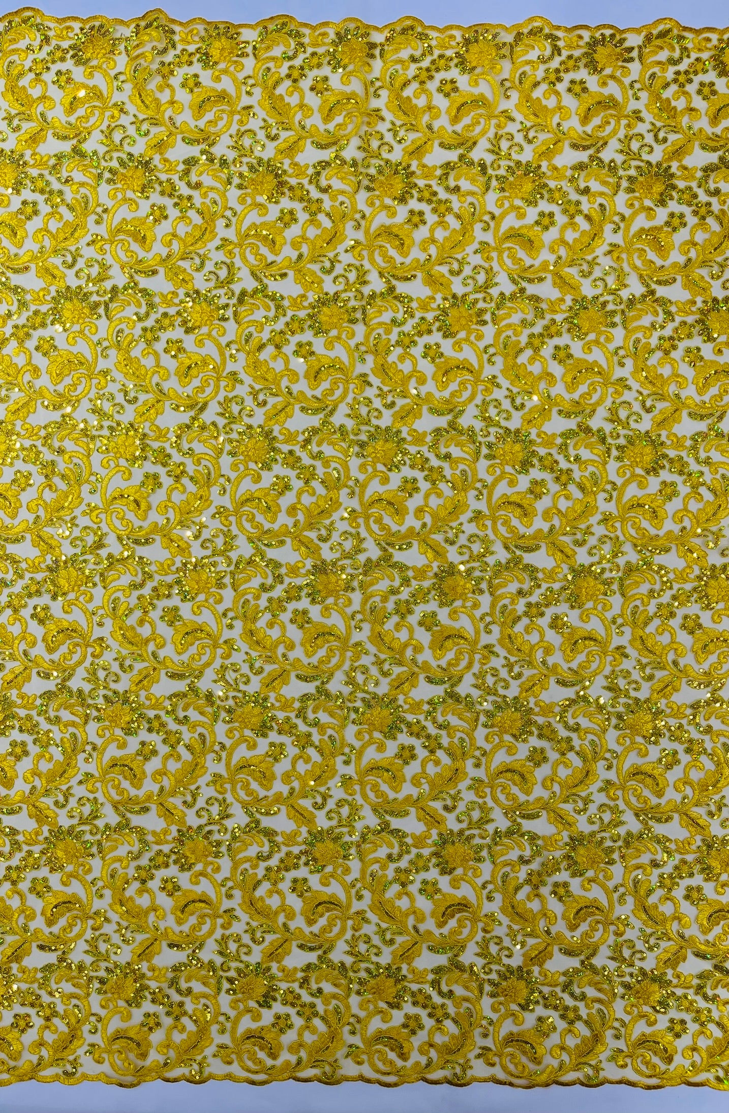 Metallic Corded Lace Design Embroidered With Holographic Sequins on a Mesh 54” Wide.